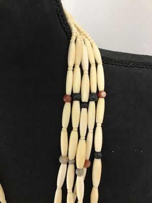 Sale Photo Thumbnail #12: Multi-strand Native American style hairpipe bead necklace featuring off-white smooth bone or horn pipe beads interspersed with colorful polished round stone accents (including agate and jasper colors). Features small seed beads near the secure metal hook 
