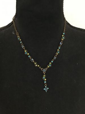 Sale Photo Thumbnail #23: Antiqued brass-tone Y-drop necklace set with blue, teal, and lime green rhinestones in delicate filigree scroll links. Features a lobster claw clasp with an adjustable extender chain. Good pre-owned condition with all stones intact.