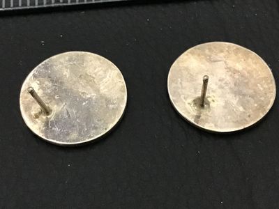 Sale Photo Thumbnail #173: A pair of round sterling silver stud earrings featuring a cut-out overlay design in a Southwestern / Hopi style geometric motif with textured recessed background. Measure approximately 3/4 inches in diameter. Minor surface wear and natural patina appropri