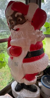 Sale Photo Thumbnail #59: Vintage Empire blow mold Santa Claus figure holding a list, featuring molded glasses and traditional red and white attire. Hard to find! 