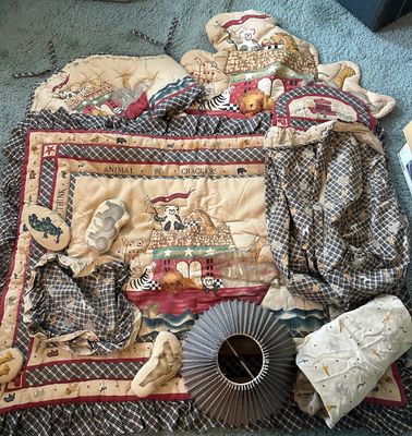 Sale Photo Thumbnail #165: Vintage Noah's Ark "Animal Crackers" nursery bedding set, including a quilted blanket, crib bumpers, decorative pillows, and matching accessories and a lamp shade. 