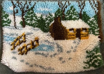 Sale Photo Thumbnail #28: Vintage handmade latch hook rug or wall hanging featuring a snowy winter cabin scene.