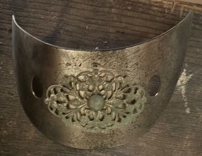 Sale Photo Thumbnail #158: Vintage metal hair cuff with intricate filigree center medallion and green cabochon accent.