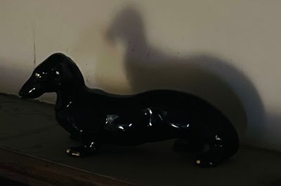 Sale Photo Thumbnail #55: Glossy black ceramic dachshund figurine 