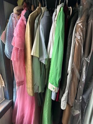 Sale Photo Thumbnail #45: Closet packed with vintage men's and women's clothing from the 1960s and 1970s, including a bright pink lace dress, a green corduroy shirt, and suede jackets. Lots of goodies in here 
