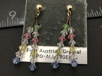 Sale Photo Thumbnail #45: Pair of Ambassador brand dangle pierces earrings featuring multi-color faceted Fine Austrian Crystal bicone beads (clear, green, pink, yellow, blue) on gold-tone ball studs. Still on original card marked 'Fine Austrian Crystal' and 'Hypo-Allergenic'. Drop