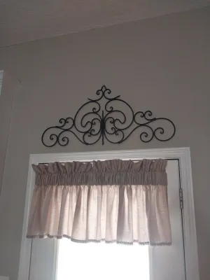 Sale Photo Thumbnail #101: Black wrought iron scrollwork wall pediment or door topper in traditional scroll motif.