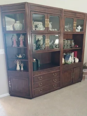 Sale Photo Thumbnail #18: Large Asian-style three-piece dark wood wall unit with glass-front display cabinets, open shelving, and lower drawers.