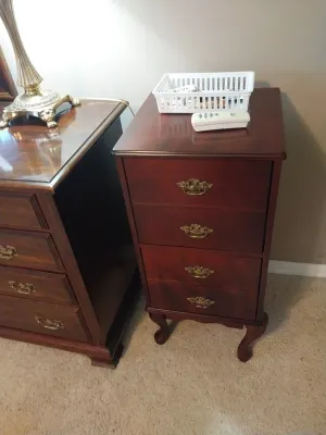 Sale Photo Thumbnail #87: Traditional mahogany accent chest with four drawers, ornate brass hardware, and Queen Anne style cabriole legs.