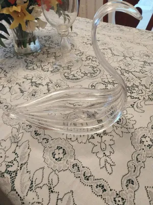 Sale Photo Thumbnail #38: Vintage clear blown glass swan figurine bowl featuring a graceful curved neck and ribbed body detail.