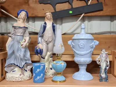 Collection of blue and white vintage decor, including pair of porcelain courter figurines, a light blue urn-shaped jar with lid, a...