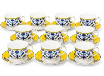Sale Photo Thumbnail #111: Set of ten fine porcelain teacups and matching saucers, featuring blue floral damask patterns with bright yellow rims.