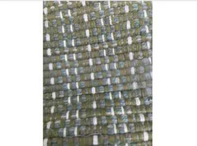 Sale Photo Thumbnail #141: Close-up detail of a thick woven area rug or textile featuring green, blue-gray, and white yarns.