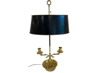 Sale Photo Thumbnail #67: Vintage French bouillotte table lamp featuring a brass base with two candle holders and a dark metal shade.