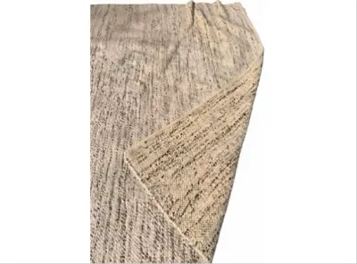 Sale Photo Thumbnail #53: Modern textured area rug featuring a neutral cream and speckled brown pattern, shown with a folded corner revealing its woven underside.