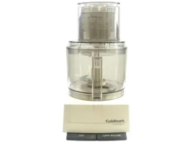 Sale Photo Thumbnail #123: Vintage Cuisinart Custom 11 food processor featuring a white motor base and clear plastic work bowl with chopping blade attachment.
