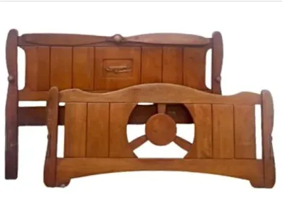 Sale Photo Thumbnail #14: Vintage aviation-themed wooden twin headboard and footboard set, featuring propeller and airplane carvings in a warm maple finish.