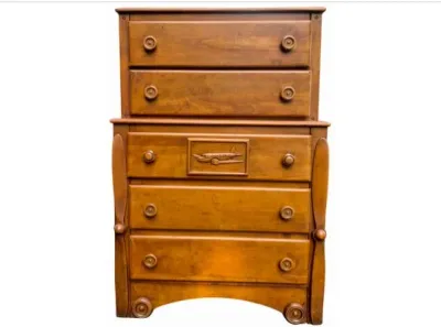 Sale Photo Thumbnail #15: Vintage airplane-themed wooden tallboy dresser featuring propeller side accents and a carved airplane panel on the upper middle drawer.
