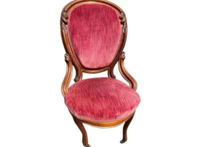 Sale Photo Thumbnail #19: Victorian-style carved wooden accent chair upholstered in crimson velvet with cabriole legs.