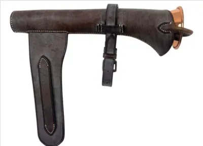Sale Photo Thumbnail #97: Vintage dark brown leather hunting horn case with saddle mounting straps, housing a copper horn inside.