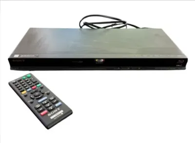 Sale Photo Thumbnail #200: Black Sony Blu-ray Disc player with accompanying remote control and power cord.