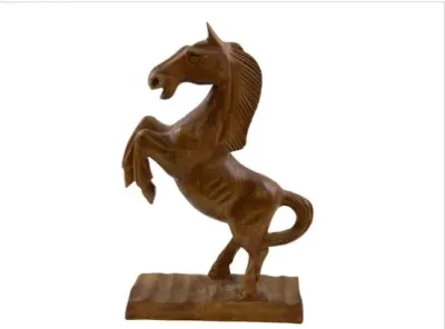 Sale Photo Thumbnail #86: Hand-carved wooden sculpture of a rearing horse, mounted on an integrated wooden base.