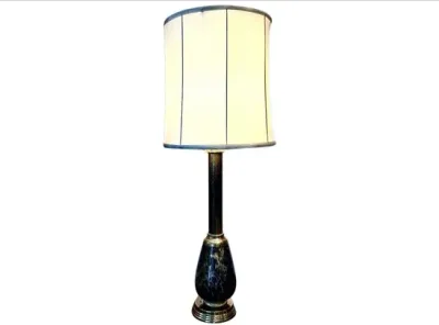 Sale Photo Thumbnail #60: Vintage table lamp featuring a dark marbleized ceramic and brass base paired with a tall off-white drum shade.