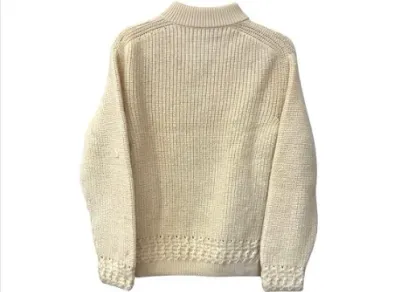 Sale Photo Thumbnail #142: Vintage cream-colored ribbed knit wool sweater featuring detailed woven trim along the cuffs and hem.
