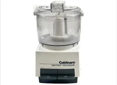 Sale Photo Thumbnail #124: Cuisinart Mini-Prep food processor in white, featuring clear plastic work bowl and dual speed settings.
