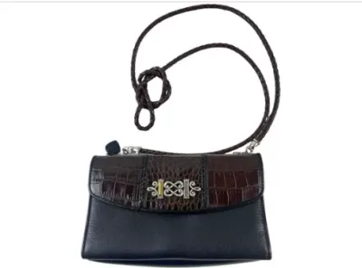 Sale Photo Thumbnail #150: Brighton two-tone black and dark brown leather crossbody purse, featuring faux-croc textured flap and ornate silver-tone hardware accent with a braided strap.