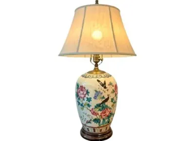 Sale Photo Thumbnail #65: Vintage Asian-style hand-painted ceramic table lamp featuring a floral and bird motif on a wooden base with a fabric lampshade.