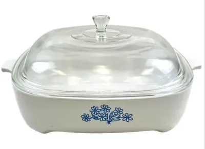 Sale Photo Thumbnail #116: Vintage Corning Ware square casserole dish with blue daisy pattern and original clear glass lid.