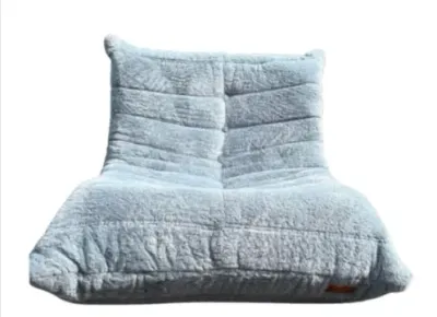 Sale Photo Thumbnail #190: Light blue plush Togo-style fireside lounge chair upholstered in a soft, textured fabric.