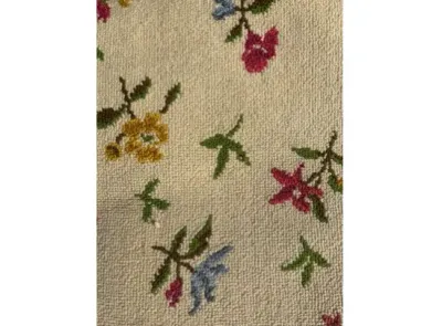 Sale Photo Thumbnail #57: Close-up view of floral rug featuring a repeating floral sprig pattern in yellow, pink, and blue on an off-white background.
