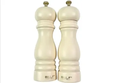 Sale Photo Thumbnail #136: Pair of Bill.F cream-colored wooden salt and pepper mills featuring a classic turned design with brass adjustment knobs.