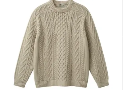 Sale Photo Thumbnail #144: Cream-colored chunky cable-knit pullover sweater with ribbed crew neck, cuffs, and hem.