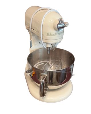 Sale Photo Thumbnail #7: Off-white KitchenAid Epicurean stand mixer with stainless steel bowl and attachment accessories.