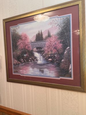 Sale Photo Thumbnail #21: Framed landscape art print featuring a stone bridge, waterfall, and blooming pink trees, set in a double mat and ornate gold-tone frame.