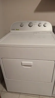 Sale Photo Thumbnail #34: White Whirlpool top-load electric clothes dryer with front-access lint filter, featuring a $200 price sticker on the control panel.