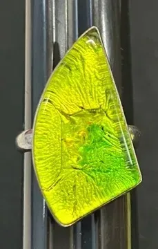 Sale Photo Thumbnail #15: Contemporary sterling silver ring featuring a large, asymmetrical vibrant yellow-green dichroic art glass cabochon.