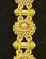 Sale Photo Thumbnail #21: Intricate gold-tone link bracelet featuring filigree stations and textured connectors.