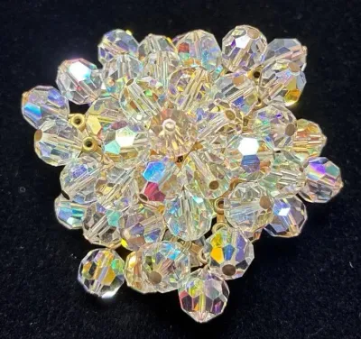 Sale Photo Thumbnail #102: Vintage aurora borealis crystal glass beaded dome brooch featuring faceted iridescent beads wire-strung in a floral cluster.