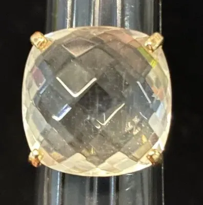 Sale Photo Thumbnail #5: Large faceted smoky quartz ring set in a four-prong gold band, displayed on a ring sizer mandrel.