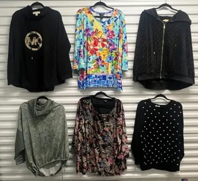 Sale Photo Thumbnail #104: Collection of women's long-sleeve tops and hoodies, featuring designer pieces including a black Michael Kors logo hoodie and colorful patterned tunics.