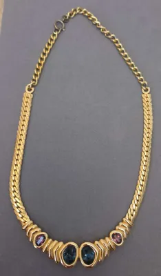 Sale Photo Thumbnail #36: Vintage gold-tone curb link chain necklace featuring a central station with bezel-set teal and purple crystal stones.