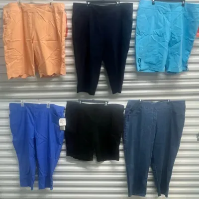 Sale Photo Thumbnail #48: Collection of women's plus-size shorts and cropped capri pants displayed on hangers, including colorful and neutral tones.