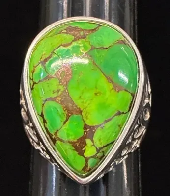 Sale Photo Thumbnail #99: Sterling silver ring featuring a large teardrop-shaped green turquoise or gaspeite cabochon with rich brown matrix.