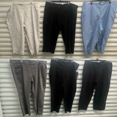 Sale Photo Thumbnail #50: Collection of six pairs of women's plus-size pants and capris in various colors and styles, displayed hanging.
