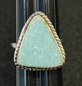 Sale Photo Thumbnail #17: Triangular light blue druzy stone ring set in a silver-tone twisted rope bezel, displayed on a ring mandrel.