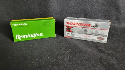 Two boxes of rifle ammunition, including Remington High Velocity and Winchester Super-X 30-30 Win 170 Grain Power-Point cartridges.